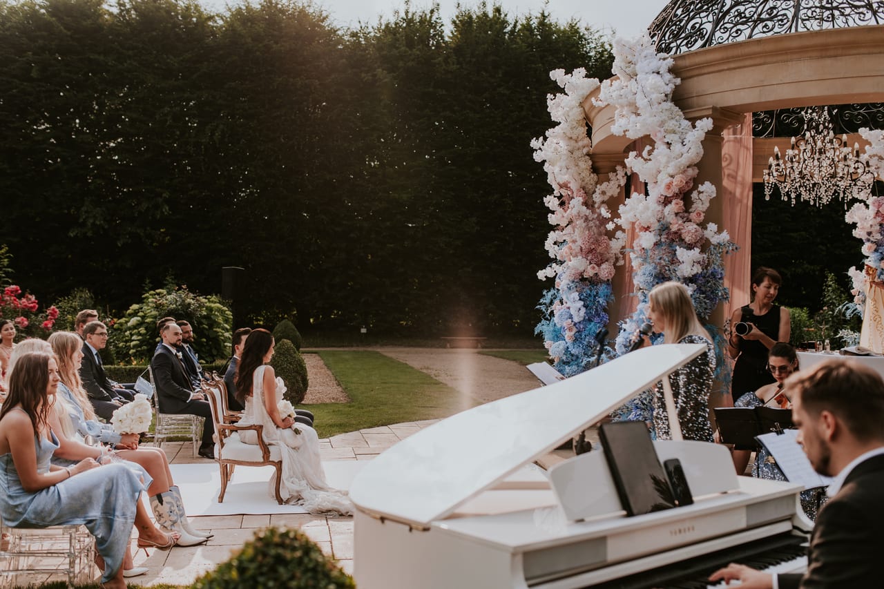 Musicians performing during an open-air church ceremony