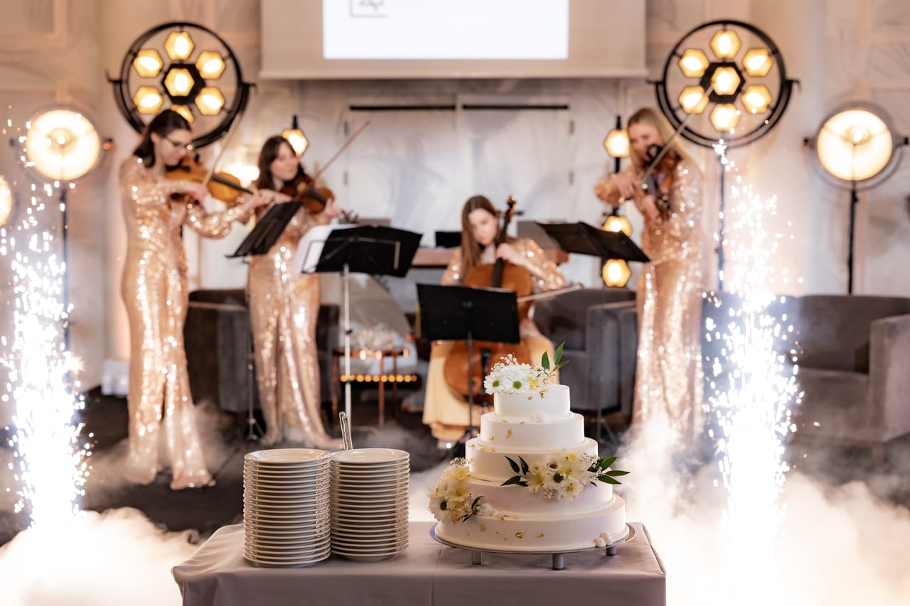 The wedding cake service accompanied by live music